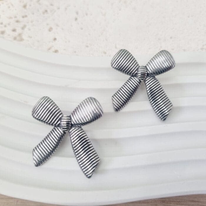 Ατσάλινα σκουλαρίκια φιόγκοι - Image 1