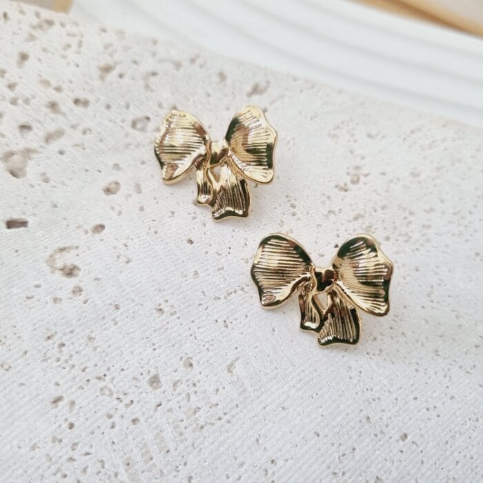 20250313_104808 Ατσάλινα σκουλαρίκια φιογκάκια - Image 1