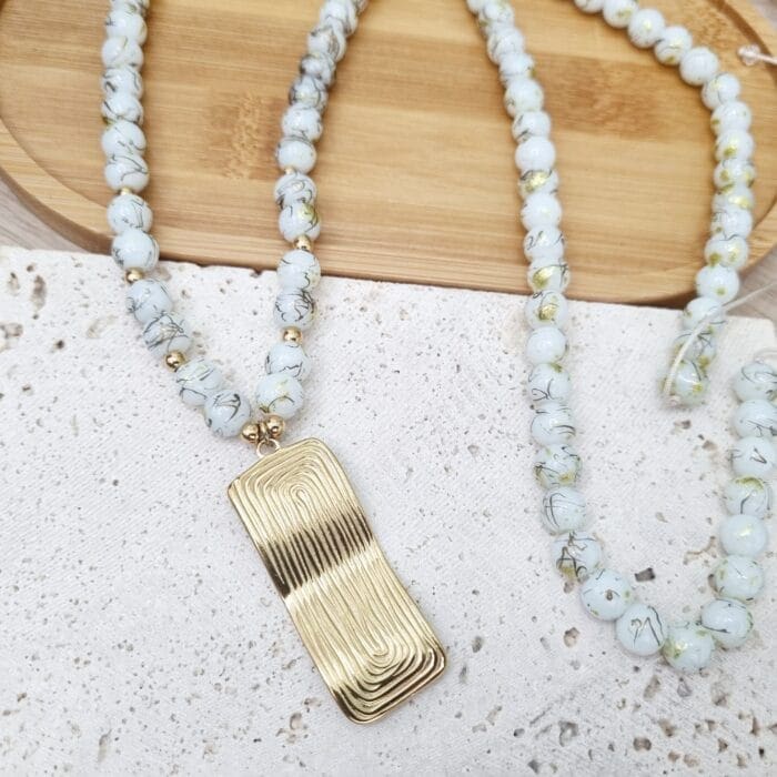 20250602_105347 Μακρύ κολιέ με ατσάλινο ανάγλυφο στοιχείο και γυάλινες χάντρες - Image 1