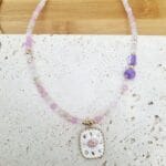 Κολιέ με κρυσταλλάκια και ατσάλινο στοιχείο με μάτι