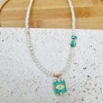 Κολιέ με κρυσταλλάκια και ατσάλινο στοιχείο με μάτι