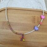 Κολιέ από χάντρες με λουλούδι και πεταλούδες - Image 2