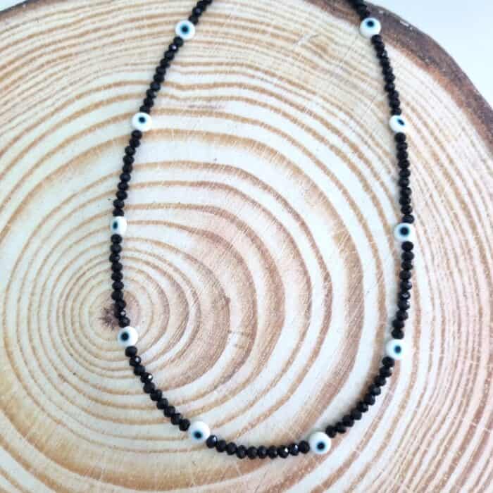 Κολιέ με μαύρα κρύσταλλα και ματάκια - Image 1